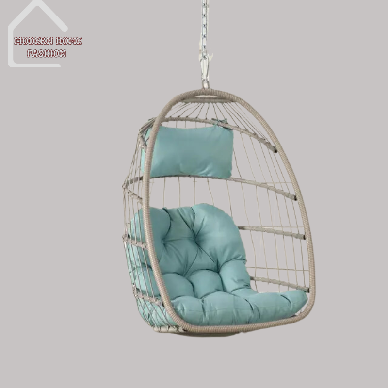 Egg Wicker Swing Chair, crafted from durable wicker material, features a unique egg-shaped design that adds a modern twist to any setting. Comes with plush cushions for added comfort, with sturdy steel frame ensures stability & support, while the hanging design adds a whimsical charm to your decor.-MODERN HOME FASHION