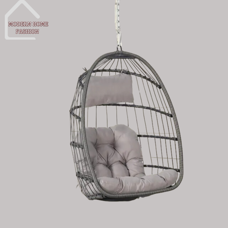 Egg Wicker Swing Chair, crafted from durable wicker material, features a unique egg-shaped design that adds a modern twist to any setting. Comes with plush cushions for added comfort, with sturdy steel frame ensures stability & support, while the hanging design adds a whimsical charm to your decor.-MODERN HOME FASHION