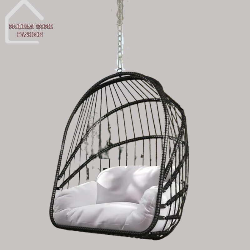 Egg Wicker Swing Chair, crafted from durable wicker material, features a unique egg-shaped design that adds a modern twist to any setting. Comes with plush cushions for added comfort, with sturdy steel frame ensures stability & support, while the hanging design adds a whimsical charm to your decor.-MODERN HOME FASHION