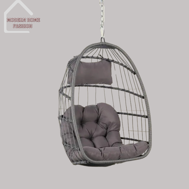 Egg Wicker Swing Chair, crafted from durable wicker material, features a unique egg-shaped design that adds a modern twist to any setting. Comes with plush cushions for added comfort, with sturdy steel frame ensures stability & support, while the hanging design adds a whimsical charm to your decor.-MODERN HOME FASHION